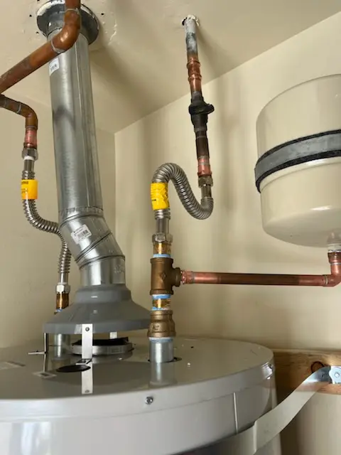 Water heater installation and plumbing repair in Grassland